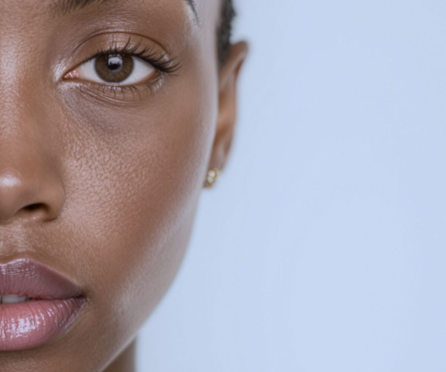 The right half of the same woman's face, twenty minutes later in bathroom daylight.